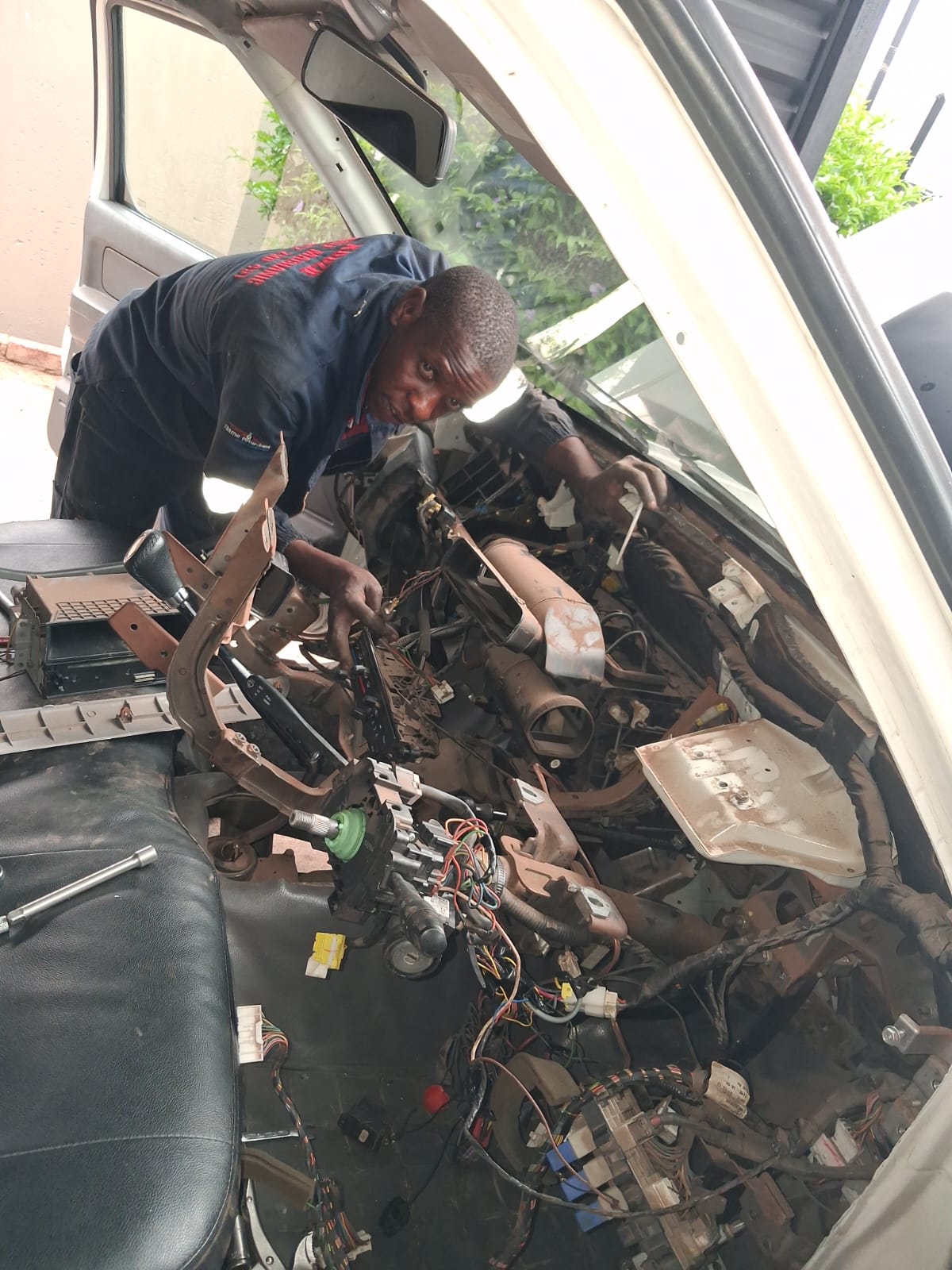 Mechanic servicing a vehicle